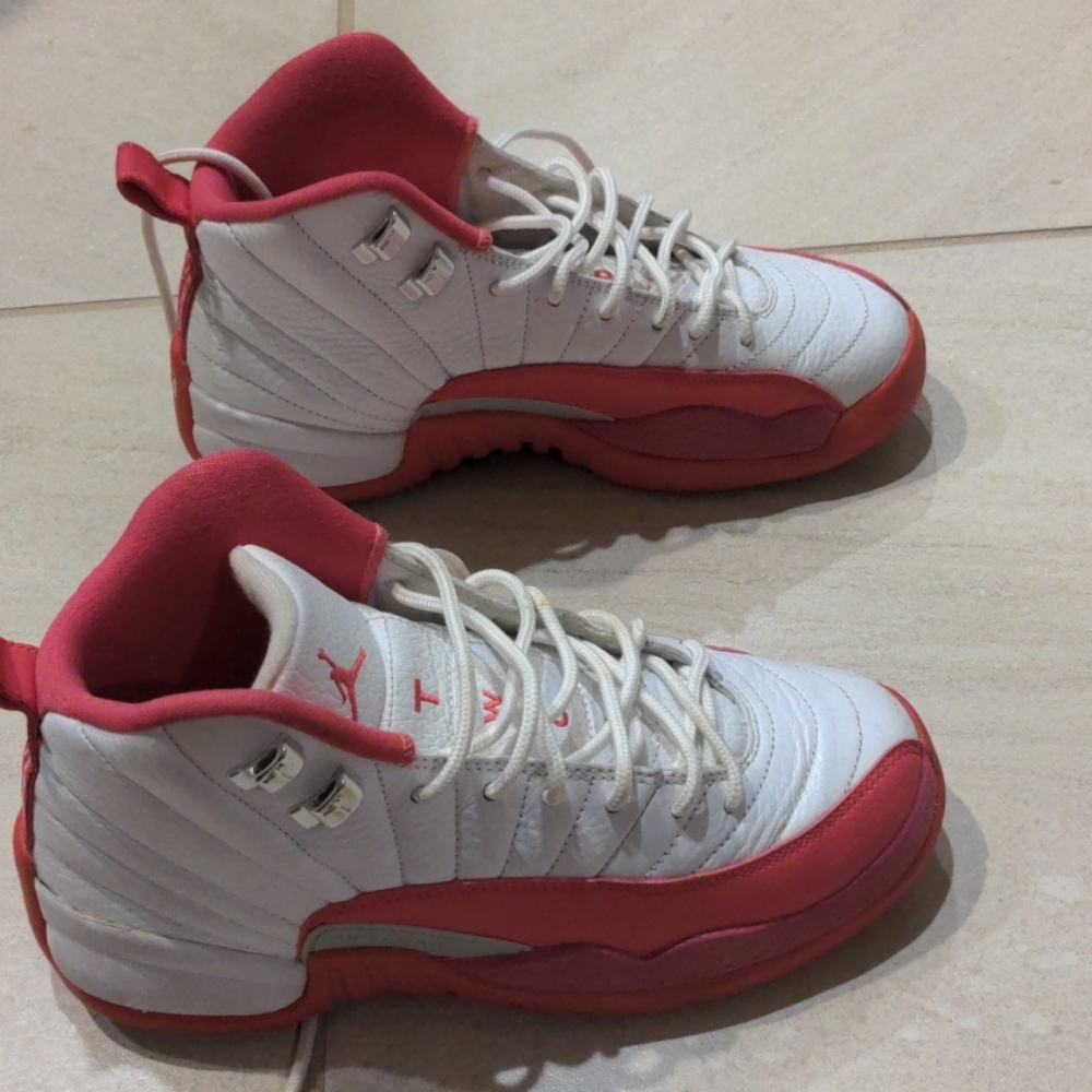 Women's pink and white Jordan 12 retro